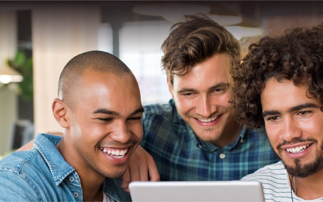 Group of men around a computer working on the budget