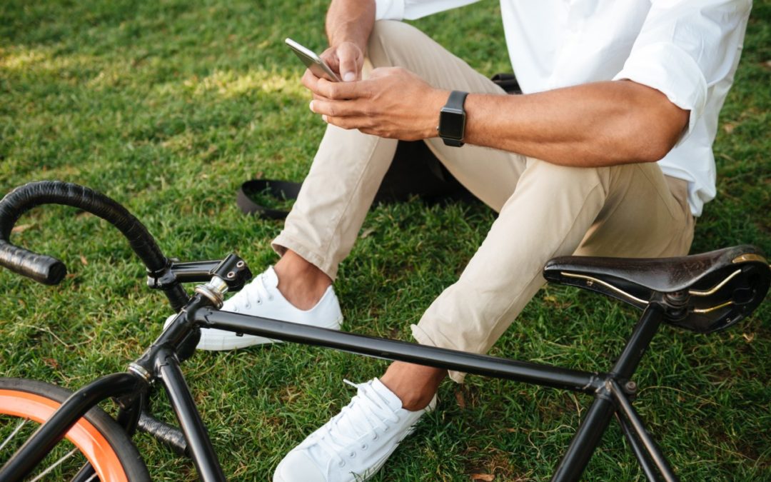 Man in grass with bike